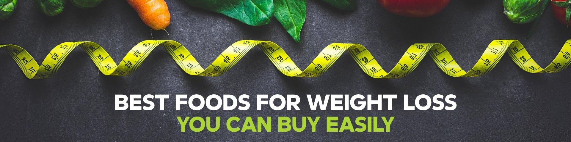 Healthy weight loss foods, including fruits, vegetables, oats, nuts, and protein-rich meals, on a table